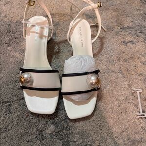 Calvin Klein White Sandals with Black and Gold Accents